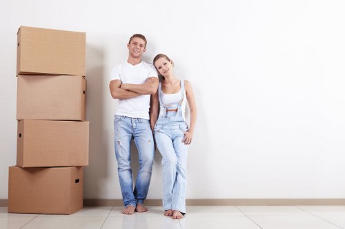 Moving boxes and packed items ready for a home move in Acton