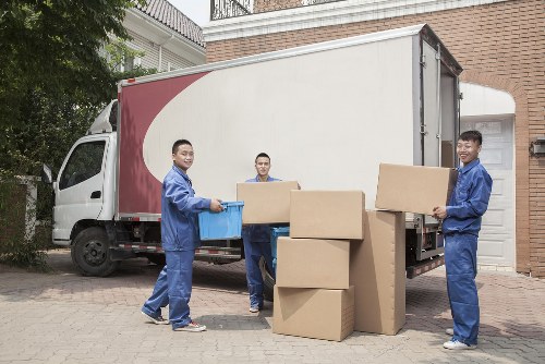 Removal team planning a home move in Acton with boxes and furniture