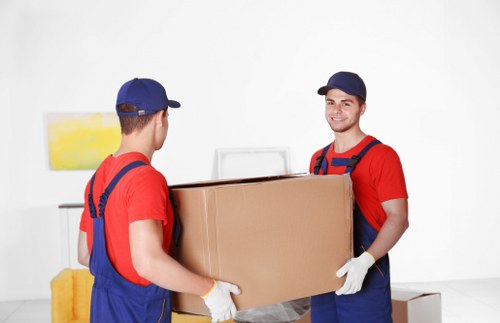 Urgent house move service in Acton with boxes and furniture being loaded