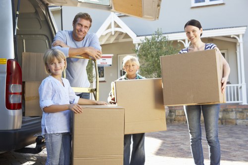Professional office relocation team handling equipment in Acton