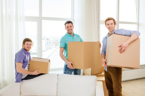 Packing supplies and labeled boxes for a house move in Acton