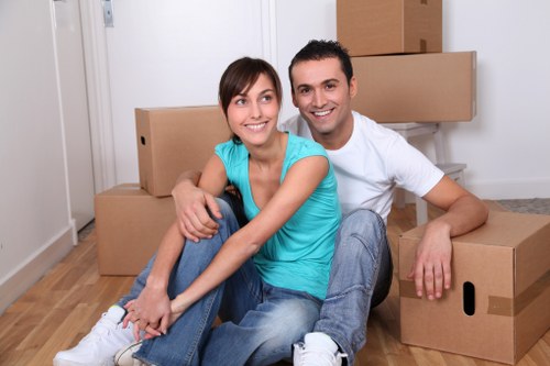 Packed moving boxes and furniture prepared for house relocation