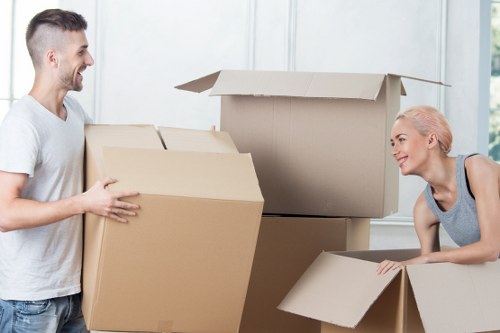 Packed boxes and furniture prepared for transport in Acton