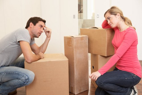 Professional movers handling office furniture during an Acton relocation