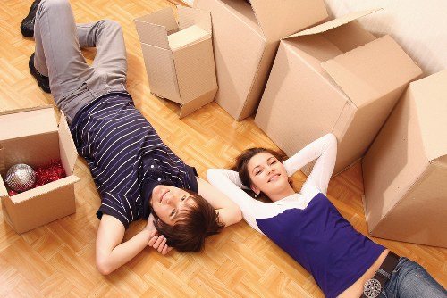 Movers carrying furniture safely during an Acton relocation