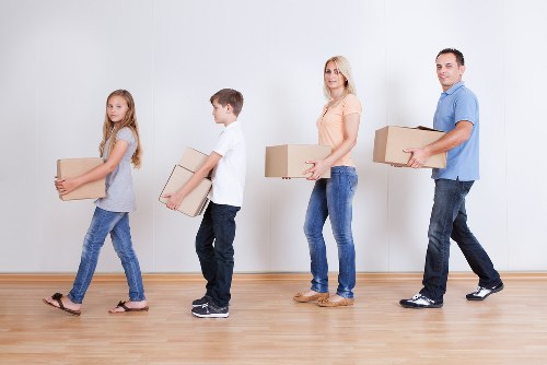 Furniture and boxes being loaded during a house removal in Acton