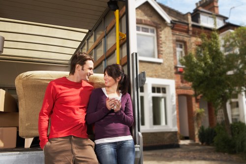 Moving team preparing items for flat removals in Acton
