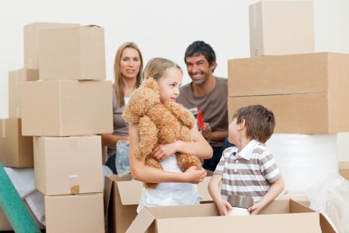 Packing supplies and labeled boxes for a house move in Acton